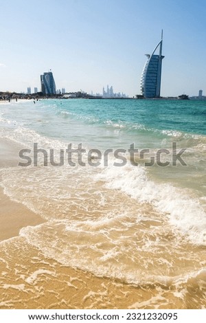 View from the beach Jumeira on famous Seven Star Hotel Burj Al Arab in Dubai, United Arab Emirates Royalty-Free Stock Photo #2321232095