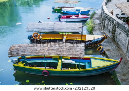 a stylized picture under oil painting. boat on the river