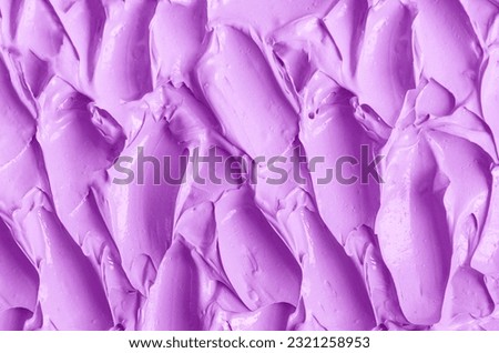 Purple clay (alginate face mask, body wrap, hair shampoo, conditioner) texture close up, selective focus. Abstract lavender background with brush strokes.