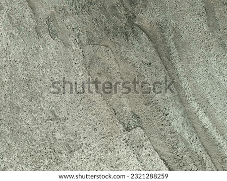 Background with green stone surface. Texture of grey-green stone. Template for backdrop, webpage, tile, packaging, photophone.