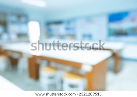 Blur image of laboratory room with microscope and television,a biology and science classroom in a modern high school,back to school concept.