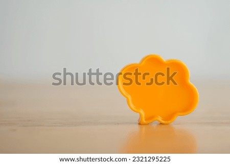 Chat bubbles on social media communication. Yellow chat bubbles icon messages on wooden background minimal style. Social media online, social network concept.