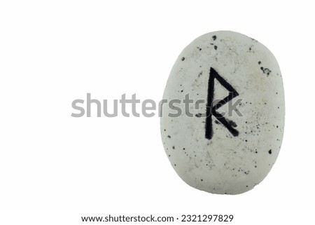 close-up of Viking stone runes isolated on white background and copy space,raido,ride,road