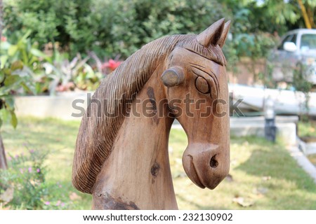 Furniture in the garden, wooden horse.