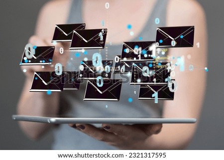 A woman presenting 3D-rendered electronic mail icons above a tablet - the concept of email marketing