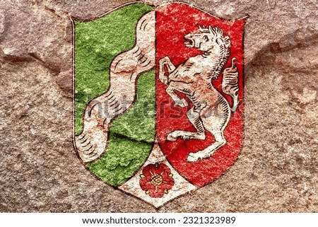 Coat of arms of Germany state North Rhine-Westfalia isolated on weathered stone wall, abstract NRW state politics culture religion history concept