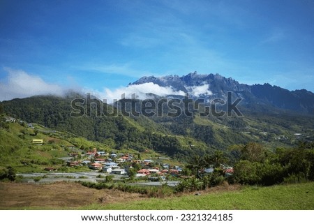 View of Mount Kinabalu with a village at the hill during the day