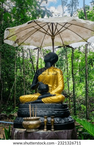Statue of a monk Pra Upakhut