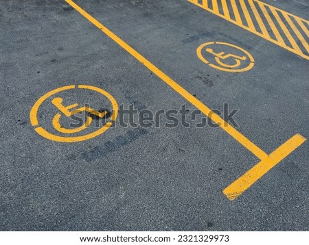 A parking lot with handicaped signs