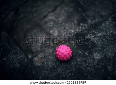 
Pink balloon on dark floor. Delicate and fluffy. Bright and playful. Symbol of joy and childhood. Adds color and happiness.