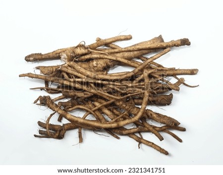 Fresh dandelion roots, lat.Taraxacum officinale on white. Traditional medicine, very good for detoxification and healthy liver.  Royalty-Free Stock Photo #2321341751