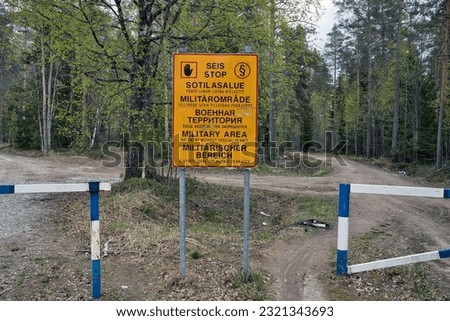 Military area keep out sign in Finnish, Swedish, Russian, English and German texts, Finland