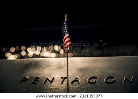 Close-up of an American flag draped across the iconic Pentagon Royalty-Free Stock Photo #2321355077