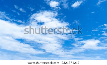 Cirrostratus clouds on a clear blue sky Royalty-Free Stock Photo #2321371217
