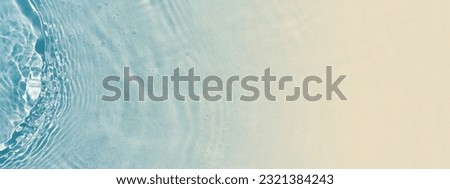 abstract sand beach from above with light blue transparent water wave and sun lights, summer vacation background concept banner with copy space, natural beauty spa outdoors Royalty-Free Stock Photo #2321384243