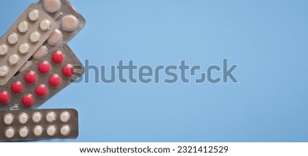 pills on a blue background, photo for a medical clinic, banner for a medical website, day of a medical worker