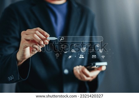 Businessman using a Smathphone for analysis SEO Search Engine Optimization Marketing Ranking Traffic Website Internet Business Technology Concept.
