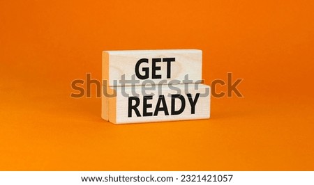 Get ready symbol. Concept words Get ready on wooden blocks on a beautiful orange table orange background. Business, support, motivation and get ready concept. Copy space.