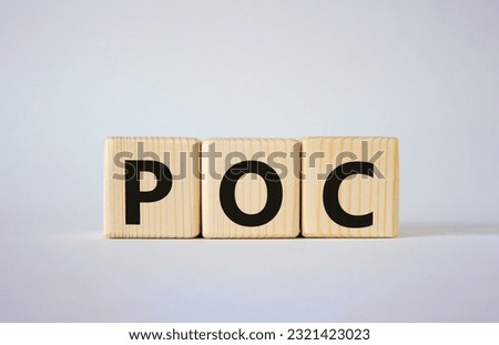 POC - Proof of Concept symbol. Wooden cubes with words POC. Beautiful white background. Business and POC concept. Copy space.