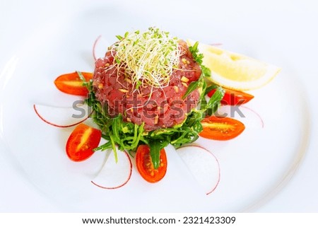 Steak Tartare,Plate with tasty beef tartare on white background 