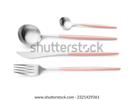 Stainless steel set of cutlery with pink handles on white background Royalty-Free Stock Photo #2321429361