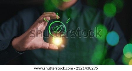 environmental, recycling, ecosystem, sustainable, economy, economic, renewable, lightbulb, bulb, recycle. catch the light bulb center has eco system icon showing. environment recycle. sustainable Royalty-Free Stock Photo #2321438295