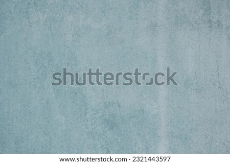 The cement wall painted turquoise. Background, texture.