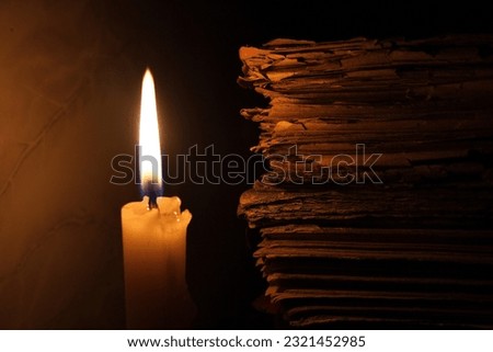 Holy book with candle background