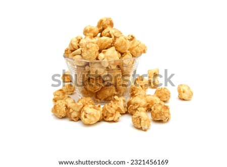 Caramel popcorn in glass bowl on a white background Royalty-Free Stock Photo #2321456169