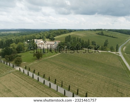 Winehouse in the vineyards around the city of Bordeaux. Royalty-Free Stock Photo #2321461757