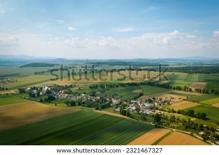 Drone view of beautiful, countryside landscape. Bobolice, aerial view of polish village, Lower Silesian landscape.  Royalty-Free Stock Photo #2321467327