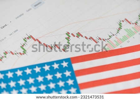 Abstract virtual financial graph hologram on USA flag and sunset sky background, forex and investment concept. Multiexposure