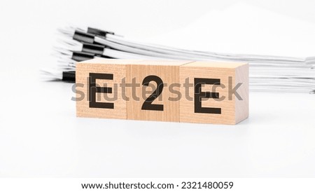 e2e wooden cubes word on white background. e2e - Exchange to Exchange concepts