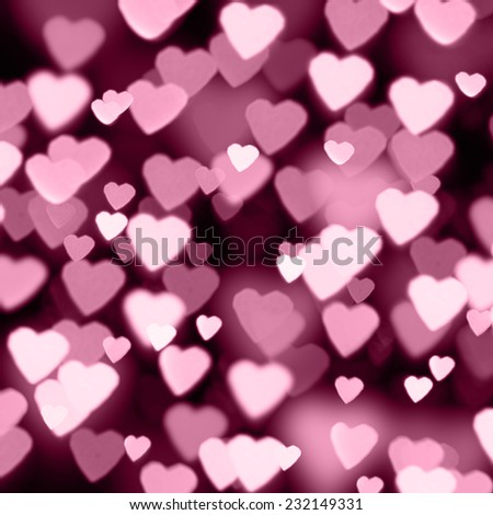 Bokeh on a dark background with hearts 