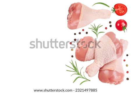 Raw chicken leg or drumstick isolated on white background with full depth of field. Top view with copy space for your text. Flat lay Royalty-Free Stock Photo #2321497885