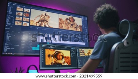 Young video maker edits movie about space mission, works at home office. Film footage and software interface with tools and sound tracks on computer and big digital screen. Concept of post production.