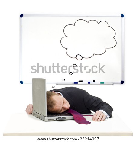 A businessman sleeping on the keyboard of his laptop with a thought cloud on the whiteboard behind him