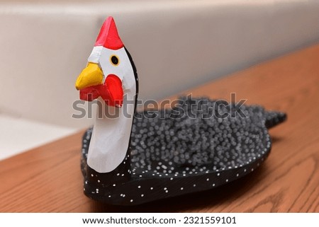 wooden guinea fowl, decorative guinea fowl, decoration with clay pieces
