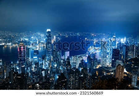 Aerial view of Hong Kong cityscape at night.