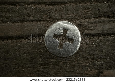 screws embedded in old wood Royalty-Free Stock Photo #2321562993