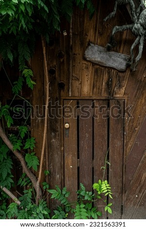 an old forest hut tree door Royalty-Free Stock Photo #2321563391