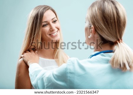 A blonde doctor deeply cares for her patient. Beyond physical health, she values human connection, trust and emotional well-being Royalty-Free Stock Photo #2321566347