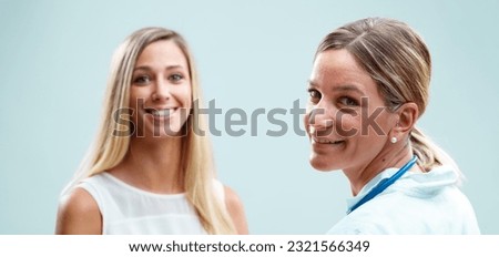 Blonde doctor genuinely caring for her patient, prioritizing physical health, emotional well-being, and fostering trust in their relationship Royalty-Free Stock Photo #2321566349
