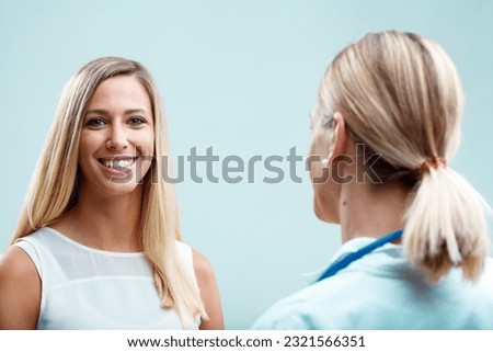 A bond of trust between a blonde doctor and patient. The doctor truly cares, addressing both the physical health and emotional needs Royalty-Free Stock Photo #2321566351
