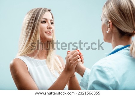 Blonde doctor and patient, a special bond. Genuine care extends beyond physical health, emphasizing human connection and trust Royalty-Free Stock Photo #2321566355