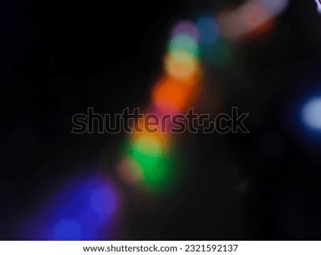Defocused abstract background of twinkling decorative lights embellishing in the dark
