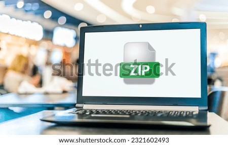 Laptop computer displaying the icon of ZIP file