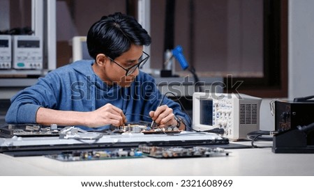 Electronics technician, electronic engineering electronic repair,electronics measuring and testing, repair and maintenance concepts. Royalty-Free Stock Photo #2321608969