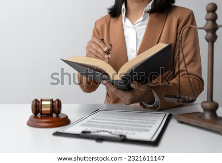 Businesswoman, lawyer working or reading law book at work on legal treaty contract document for business signing, contracting concept of legal advisor Justice. 