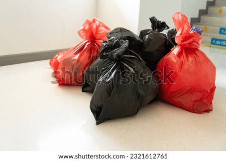Different waste bag on white floor background,Red, black and purple bags waste on white background.Garbage bags in hospital.Environment management.Infectious control concept. Royalty-Free Stock Photo #2321612765